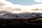 Clouds Engulfing Snowcapped Mountains