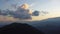 Clouds float over the mountains.