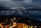 Clouds floating over mountain alpine peaks in the late evening, an atmosphere of darkness and beauty