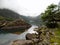 Clouds and fog above the sharp shores of Bondhusvatnet lake in Folgefonna national park, Norway