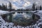 Clouds and Forest Trees Reflected in Calm Lake Water