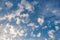 clouds in the form of bizarre shapes on a blue sky