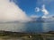 The clouds freely roaming above the beautiful volcano lake