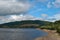 Clouds gather over the dry slopes of Lady Bower reservoir in late summer.