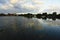 Clouds and golden sunset light reflection in Serangan Island seawater, Bali, Indonesia