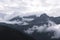 Clouds hanging over rugged mountains in Southern Alaska