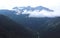 Clouds hanging over rugged mountains in Southern Alaska