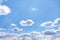 Clouds with light wind on vast bluesky background and space
