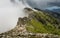 Clouds meet the top of a mountain ridge on GR20 in Corsica