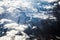 Clouds in a mountains with snow up side .