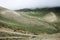 Clouds are moving down to the Nepalese high mountain green valley