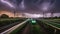 clouds in the night A lightning, speedy train lightning, that is covered in flashes as it flies over the rail