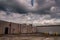 Clouds over the back of an abandoned shopping center