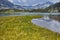 Clouds over Banderishki chukar peak and Reflection in Muratovo lake, Pirin Mountain