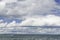 Clouds over a choppy lake