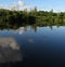 Clouds over the clear reflective lake