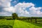 Clouds over fence and farm fields in rural York County, Pennsylvania.