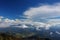 clouds over the mountains during sunset photographed from a mountain