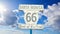 Clouds passing over `Route 66 end of the trail` sign in Los Angeles, California