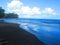 Clouds reflect in the sea by the beach