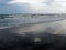 Clouds are reflected in surf waves