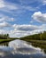 Clouds reflected in the waters of a wetland conservation area