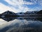 Clouds reflecting in calm waters, Svalbard, Norway