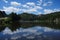 Clouds reflecting of lake in the black hills near Mount Rushmore