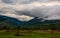 Clouds rise in mountains on overcast morning