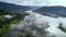 Clouds roll over alpine lake in mountains