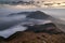 Clouds rolling over a mountain on Lantau Island at dawn