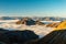 Clouds sea floating in alpine valley in sunrise in autumn, Grossglockner area, Tyrol, Austria