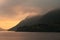 Clouds shrouding the mountains on a dull morning at Ullswater in the Lake District.