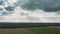 Clouds In Sky Above Empty Countryside Rural Field Landscape In Spring Cloudy Day. Agricultural Field. Aerial View. Drone