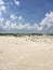 Clouds and sky along the dunes of Assateague Island with wild horses in the background