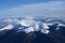 Clouds in snowy mountain tops in winter in Busteni Romania