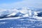 Clouds in snowy mountain tops in winter in Busteni Romania