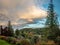 Clouds start to turn orange at sunset looking out over the fall colors near Stonefield Castle in Argyll and Bute Scotland UK