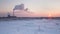 Clouds of steam cogeneration plant over winter evening at sunset.