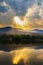 Clouds and sunbeam over mountain