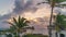 Clouds at sunrise Time lapse balcony Kauai Hawaii with palm trees and ocean