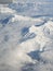 Clouds surrounding the rocky mountains while flying in to Utah