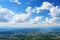 Cloudscape. Aerial view. Clouds. Blue sky background with tiny clouds. View from airplane window. Copy space.