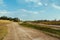 Cloudscape blue sky river lake forest sand beach daylight landscape