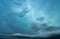 Cloudscape on dark blue sky. Blue sky and white fluffy clouds. Peaceful and tranquil background. Stormy sky. Nature background.