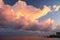 Cloudscape in dramatic pink and yellow light