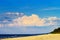 Cloudscape with huge cumulonimbus cloud formation over the beach at Baltic sea.