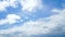 Cloudscape with large, moving clouds and blue sky