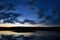 Cloudscape over lake at dusk