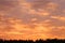 Cloudscape panorama over sunser sky.